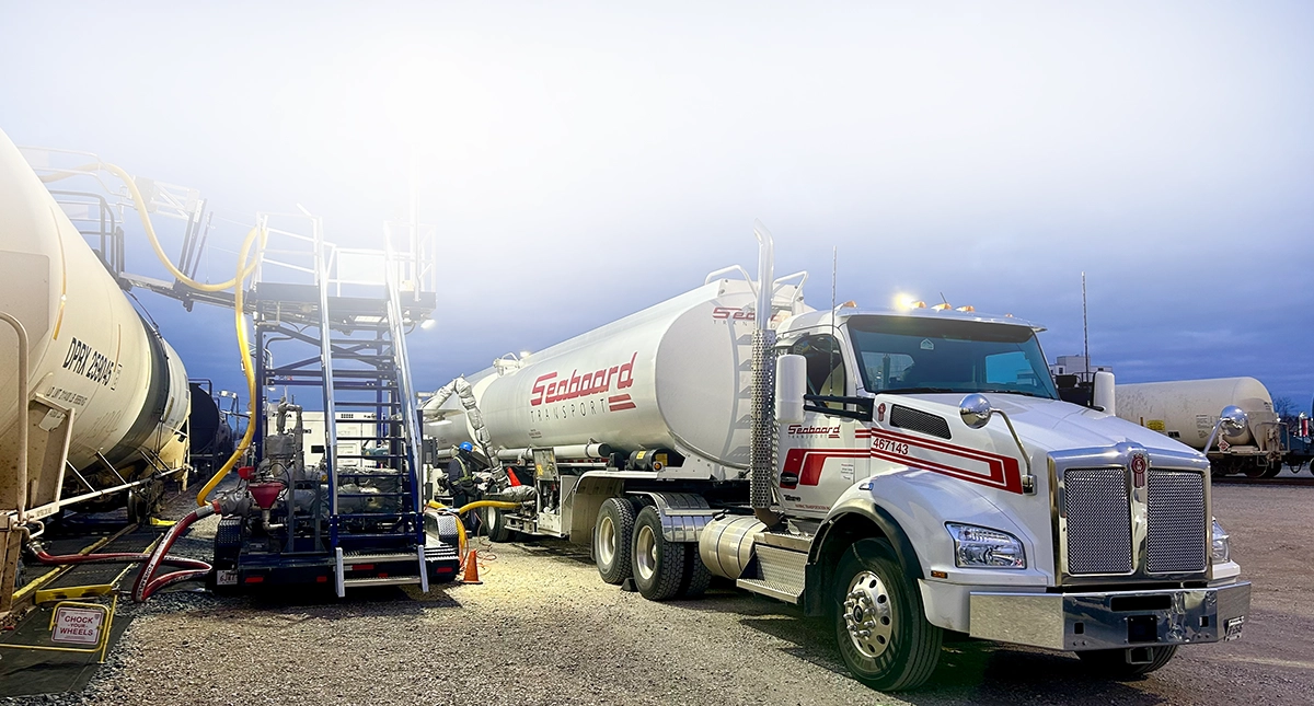 Bulk liquid freight being transloaded from Seaboard double tanker truck to rail